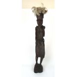An early 20th century Zulu carved warrio