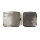 Two silver cigarette cases having engine