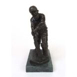 A bronze figure of the cricketer W G Gra