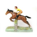 A Beswick model of a girl on a jumping h