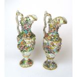 A pair of continental porcelain ewers ha