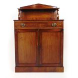 An early 19th century mahogany chiffonie