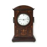 An Edwardian mahogany mantle clock, the
