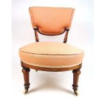 An Edwardian walnut bedroom chair uphols