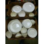 Two trays of white ceramic tableware to