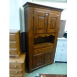 A modern stained wooden cabinet having a