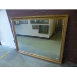 A large rectangular gilt framed bevel gl