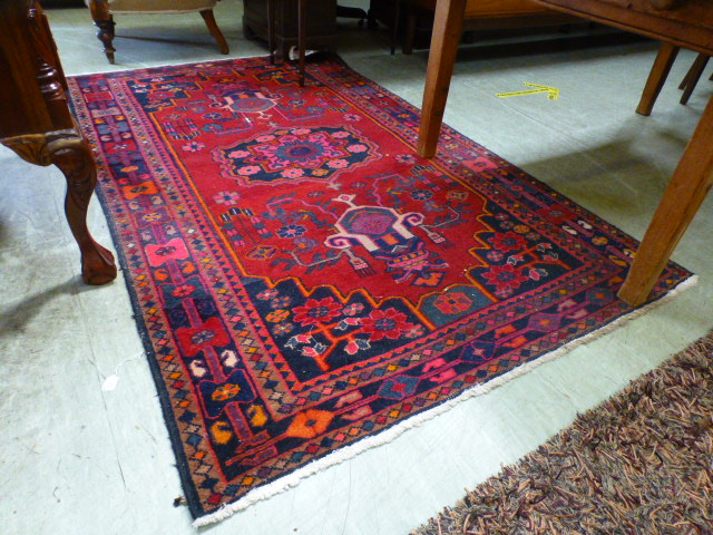 A rectangular red ground Persian style r