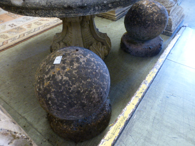Two weathered garden stoneware spheres o