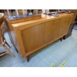 A mid-20th century sideboard having a pu