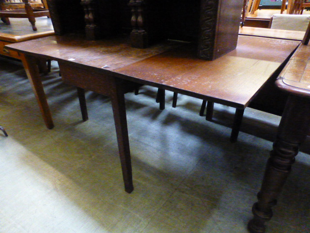 A 19th century oak drop-leaf table