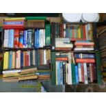 Four trays of hardback books by various