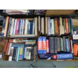 Four trays of hardback books by various