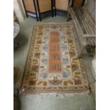 A handwoven Turkish rug, the border surr