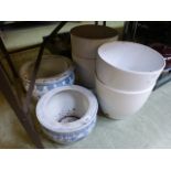 Four large modern garden pots together w