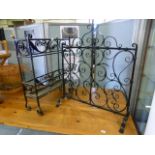 A black painted wrought iron stick stand