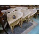 A set of six wicker tub chairs