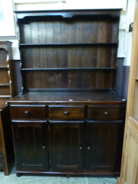 A stained pine reproduction dresser havi