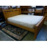 A modern pine king sized oak bedstead wi