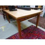 An old farmhouse style pine dining table