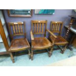 A pair of oak framed dining chairs toget