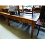 An early 20th century oak desk with a bl