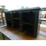 An early 20th century carved oak cabinet