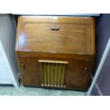 A mid-20th century walnut cabinet having