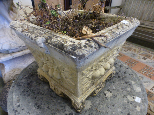 A weathered stoneware planter