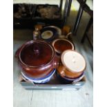 A tray containing salt glazed cook pots,