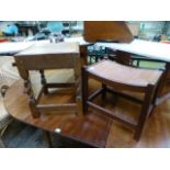 An early 20th century oak stool with bar