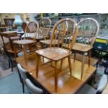 A set of four spindle back dining chairs