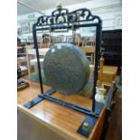 A wrought iron and brass gong