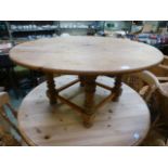 A circular pine occasional table