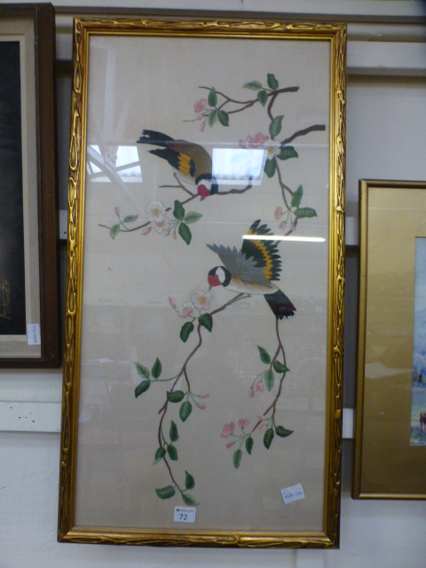 A framed and glazed embroidery of birds