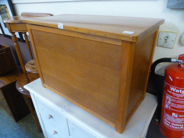 A mid-20th century oak and ply Ottoman