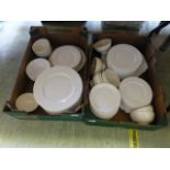 Two trays of white ceramic tableware to