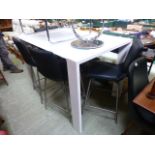 A modern high gloss white tall dining ta