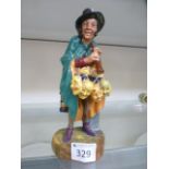 A Royal Doulton figure 'The Mask Seller'