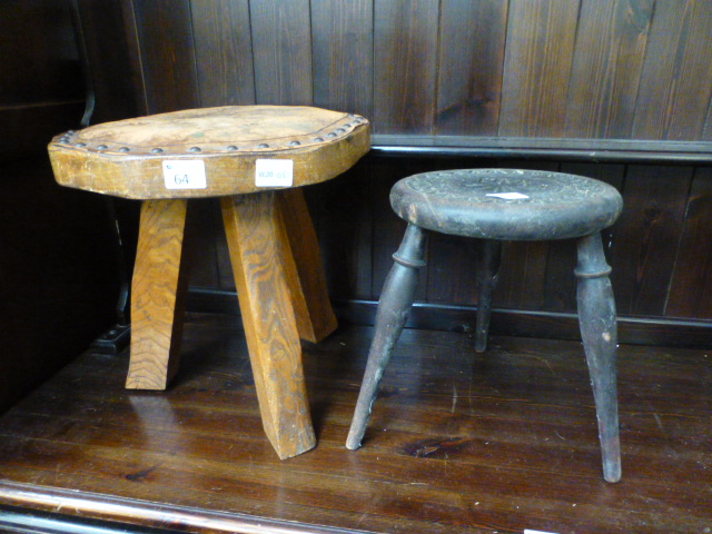 A small carved three-legged stool togeth