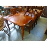 A reproduction extending dining table wi