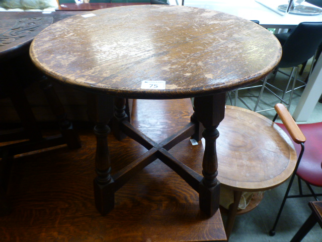 An early 20th century oak circular toppe