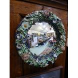 A floral decorated convex wall mirror
