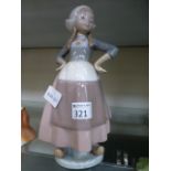 A Lladro figure of a girl in a dress