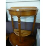 A modern pine demi lune two tier hall ta