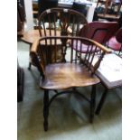 An open arm Windsor country style chair