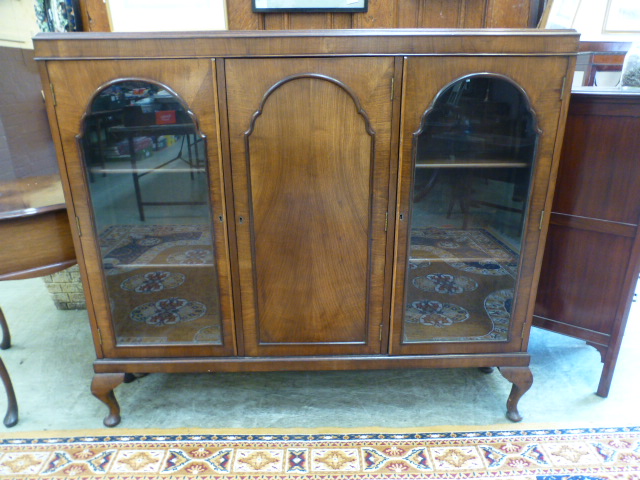 A mid-20th century walnut veneered cabin