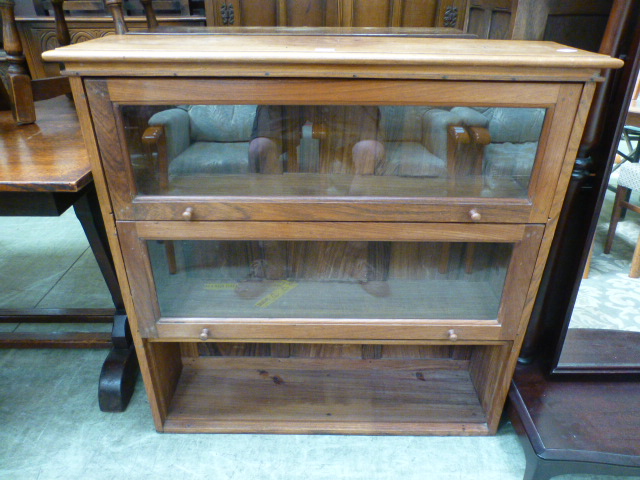 A mahogany three tier part glazed bookca