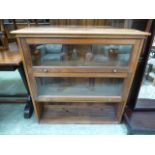 A mahogany three tier part glazed bookca