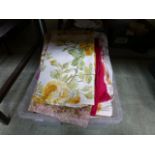 A PVC box of assorted fabric